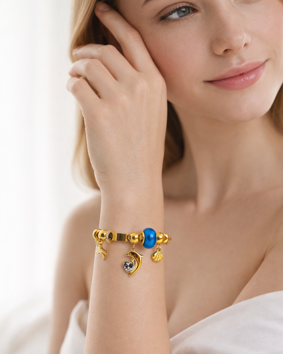 Dolphin charm, shell,and heart pendent bracelet